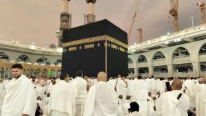 Pilgrims dressed in white gather around the Kaaba in Mecca's Grand Mosque, Saudi Arabia.